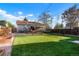 Spacious backyard with green lawn and deck for entertaining guests at 3471 W Exposition Ave, Denver, CO 80219