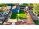 Aerial view of a home featuring a spacious backyard with lush green grass at 3471 W Exposition Ave, Denver, CO 80219