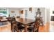 Cozy dining area with a wooden table, chairs and hardwood floors at 3471 W Exposition Ave, Denver, CO 80219