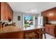 Updated kitchen featuring a breakfast bar and stainless steel appliances at 3471 W Exposition Ave, Denver, CO 80219
