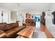 Spacious living room flowing into the kitchen and dining area at 3471 W Exposition Ave, Denver, CO 80219