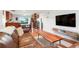 Open-concept living room with modern decor and hardwood floors at 3471 W Exposition Ave, Denver, CO 80219