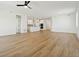 Spacious and open-concept living area with hardwood floors, recessed lighting, and access to the kitchen at 42974 Colonial Trl, Elizabeth, CO 80107