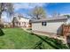 Well-maintained backyard features a garage, lawn, and fenced perimeter at 4244 Grove St, Denver, CO 80211
