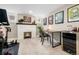 Finished basement features a fireplace, exercise equipment, and bar area at 4244 Grove St, Denver, CO 80211