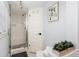 Bathroom featuring walk-in shower, white subway tile, and updated fixtures at 4244 Grove St, Denver, CO 80211