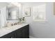 Bright bathroom with marble countertop, elegant vanity, and modern fixtures at 4244 Grove St, Denver, CO 80211