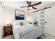 Bedroom featuring ceiling fan, closet, and an en suite bathroom at 4244 Grove St, Denver, CO 80211