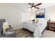 Cozy bedroom featuring a ceiling fan, closet, and comfortable furnishings at 4244 Grove St, Denver, CO 80211