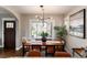 Bright dining room featuring a modern light fixture, and views of the front yard at 4244 Grove St, Denver, CO 80211
