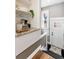 Bright entryway featuring a stylish coffee bar, white door, and modern decor at 4244 Grove St, Denver, CO 80211