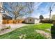 Detached garage with fenced yard and a nice lawn at 4244 Grove St, Denver, CO 80211