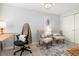 Well-lit home office space with neutral tones, stylish seating, and ample workspace at 4244 Grove St, Denver, CO 80211