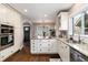 Spacious kitchen with granite counters, stainless steel appliances, and modern lighting at 4244 Grove St, Denver, CO 80211
