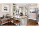 Modern kitchen with granite counters, barstool seating, and stainless steel appliances at 4244 Grove St, Denver, CO 80211