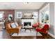 Inviting living room featuring a fireplace, hardwood floors, and stylish furniture at 4244 Grove St, Denver, CO 80211