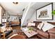 Comfortable living room with a cow hide rug, sofa, and a large picture frame on the wall at 4244 Grove St, Denver, CO 80211