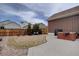 Spacious backyard featuring a well-maintained lawn, patio, and privacy fence at 4483 Fell Mist Way, Castle Rock, CO 80109