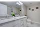 Bathroom featuring dual sinks, a large mirror, and ample counter space at 4483 Fell Mist Way, Castle Rock, CO 80109