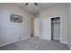 Carpeted bedroom features a ceiling fan, closet with built-in shelves, and a TV at 4483 Fell Mist Way, Castle Rock, CO 80109