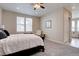 Spacious bedroom with carpeted floors, a ceiling fan, and natural light from the window at 4483 Fell Mist Way, Castle Rock, CO 80109