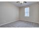 Neutral bedroom features carpet, a ceiling fan, and a window that provides natural light at 4483 Fell Mist Way, Castle Rock, CO 80109