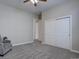 Bedroom featuring carpet, ceiling fan, window, closet, and chair for a relaxing space at 4483 Fell Mist Way, Castle Rock, CO 80109