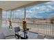 Relaxing front porch with beautiful landscape view, brick columns, and outdoor seating at 4483 Fell Mist Way, Castle Rock, CO 80109