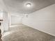 Spacious carpeted basement with neutral-colored walls at 9607 W Arizona Ave, Lakewood, CO 80232