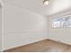 Bright bedroom with wood-look floors and window at 9607 W Arizona Ave, Lakewood, CO 80232