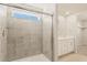 Modern bathroom with glass enclosed shower and vanity at 20982 E 66Th Ave, Aurora, CO 80019