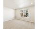 Bright bedroom featuring neutral carpet, ample natural light, and minimalist design at 20982 E 66Th Ave, Aurora, CO 80019
