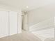 Bedroom with neutral carpet, paint and double door closet at 20982 E 66Th Ave, Aurora, CO 80019