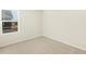 Bright bedroom featuring neutral carpet, light walls, and a large window at 20982 E 66Th Ave, Aurora, CO 80019