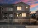 Townhome exterior with brick and siding, porch, and landscaped front at 20982 E 66Th Ave, Aurora, CO 80019