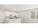 Modern kitchen featuring white cabinets, stainless steel appliances, an island with quartz countertops, and a stylish backsplash at 20982 E 66Th Ave, Aurora, CO 80019