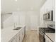 Modern kitchen showcasing stainless steel appliances and quartz countertops at 20982 E 66Th Ave, Aurora, CO 80019