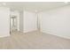 Open-plan living room with neutral decor and lots of light at 20982 E 66Th Ave, Aurora, CO 80019