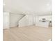 Open concept living room showing access to kitchen, doors and stairs at 20982 E 66Th Ave, Aurora, CO 80019