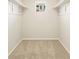 Empty walk-in closet showcasing carpet flooring, and shelving at 20982 E 66Th Ave, Aurora, CO 80019