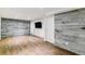 Finished basement with a wood accent wall, recessed lighting, and modern flooring at 5480 W Iowa Ave, Lakewood, CO 80232