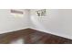 Bedroom with hardwood floors, a window, and minimalist design at 5480 W Iowa Ave, Lakewood, CO 80232