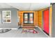 Inviting entrance area with tiled floor, wood accents, and a pop of color at 5480 W Iowa Ave, Lakewood, CO 80232