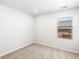 Bright, carpeted bedroom with a window and neutral decor at 742 N Tempe St, Aurora, CO 80018