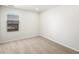 Neutral bedroom with large window, carpet, and ample natural light at 742 N Tempe St, Aurora, CO 80018