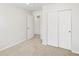 Bedroom featuring neutral carpeting, closet and doorway leading to the hallway at 742 N Tempe St, Aurora, CO 80018