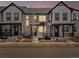 Charming townhouse showcasing stone facade, inviting porch and manicured front yard, perfect for relaxed living at 742 N Tempe St, Aurora, CO 80018