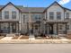 Charming townhouse showcasing stone facade, inviting porch and manicured front yard, perfect for relaxed living at 742 N Tempe St, Aurora, CO 80018