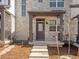 Inviting front porch with stone accents, providing a welcoming entrance to the home's exterior at 742 N Tempe St, Aurora, CO 80018