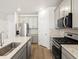 A kitchen featuring stainless steel appliances, light gray cabinetry and light countertops at 742 N Tempe St, Aurora, CO 80018